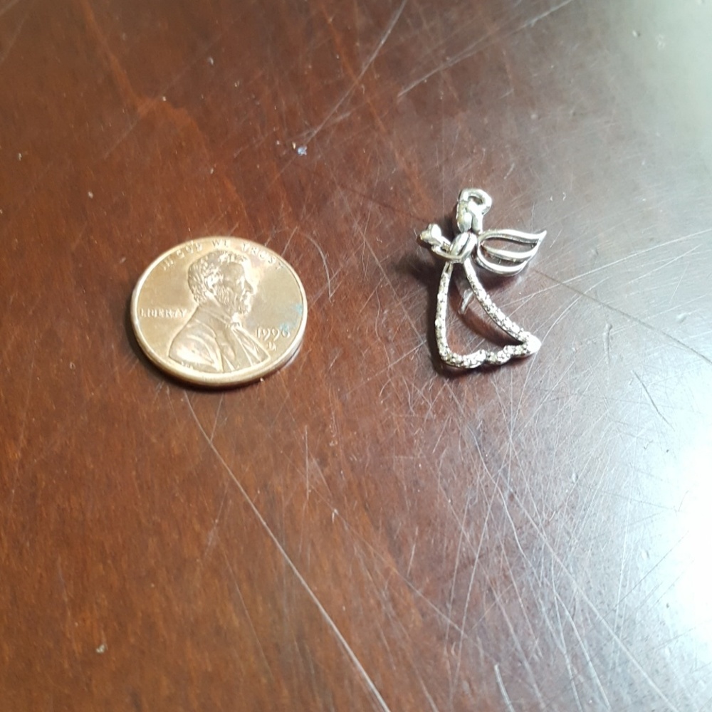 Silver Angel charm holding a heart